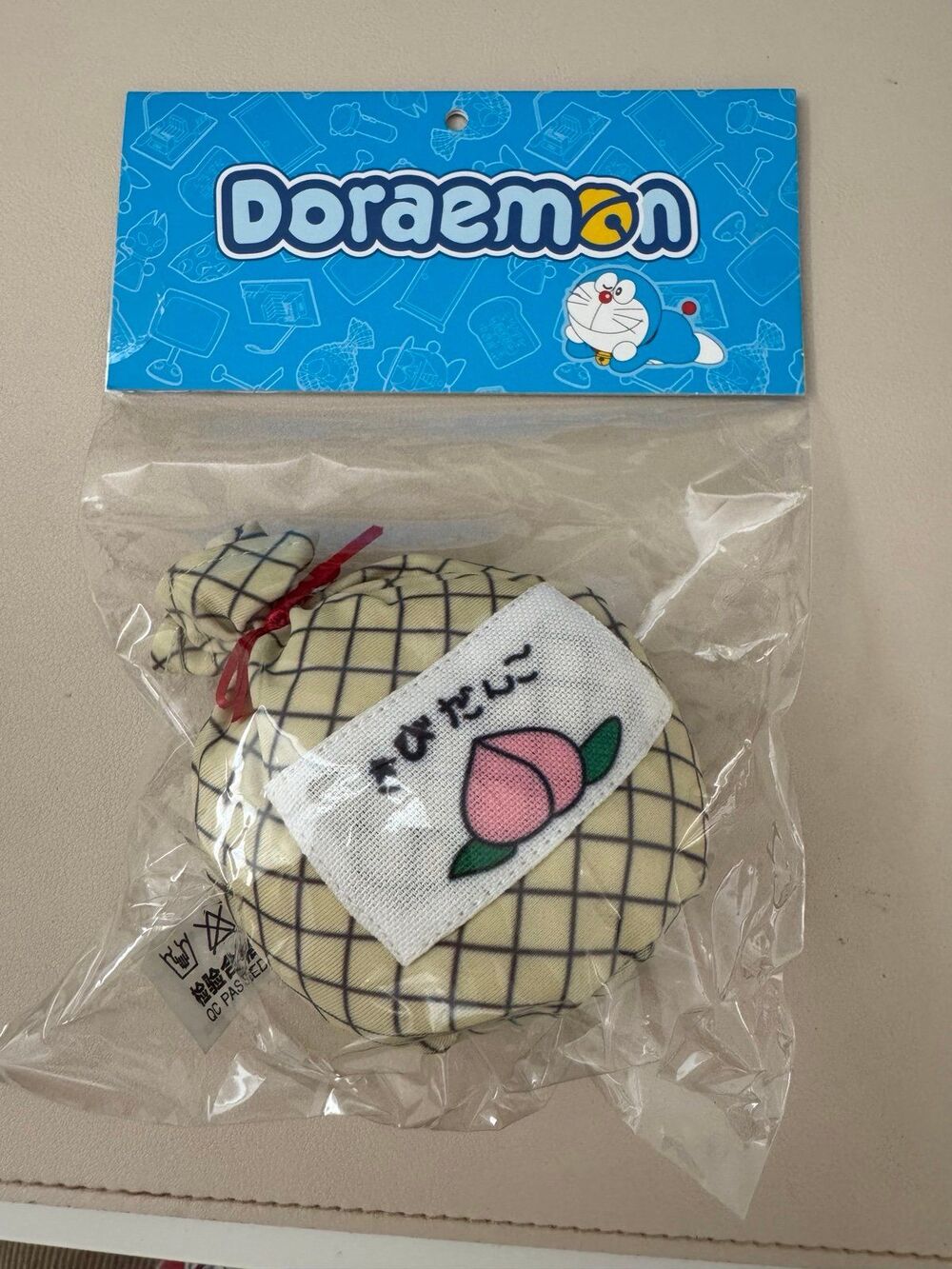 POP MART Fuxion Doraemon Plush Keychain (Momotaro Jirushi's Millet Dumplings)